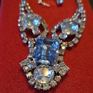 Vintage blue rhinestone necklace with a large sapphire blue centerpiece. 
